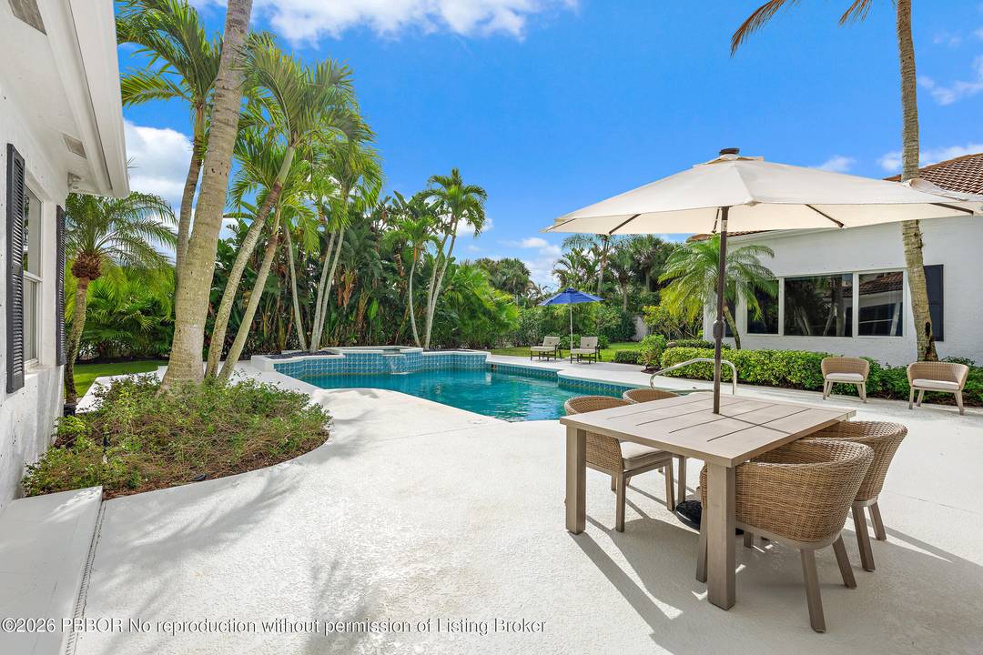 Located on a large lot on the east side of Admirals Cove, this home offers a rare combination of space, privacy, and a full golf membership.