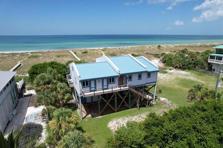 Gulf Front PARADISE. This custom built home sits directly facing the beautiful Gulf of Mexico on a Private Island with boat only access.