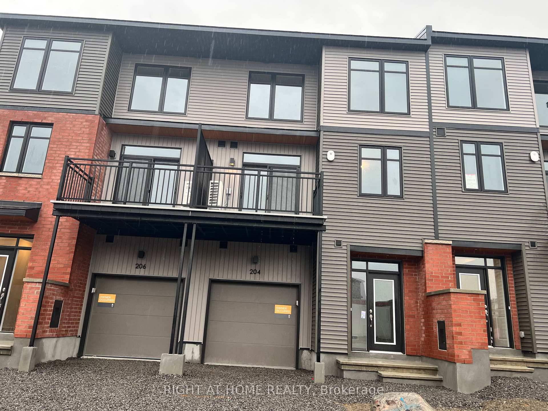 Welcome to 204 Tussock Private, a beautifully appointed back to back townhome in the desirable Pathways South community.