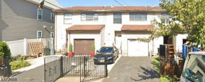 Welcome to this charming 3 bedroom, 2 bathroom home with an attached garage, located in the heart of Elizabeth, NJ.