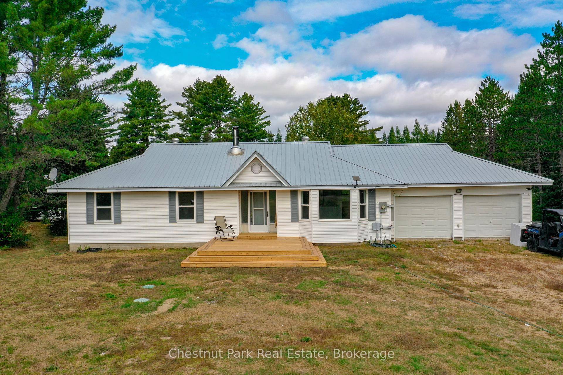 Come explore this fully updated raised ranch home in your 21 acre sanctuary, just 3 minutes from Buck Lake.