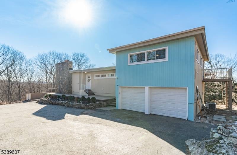 Welcome to 21 Skyview Drive, a beautifully updated contemporary home nestled in the scenic community of Ringwood, NJ.