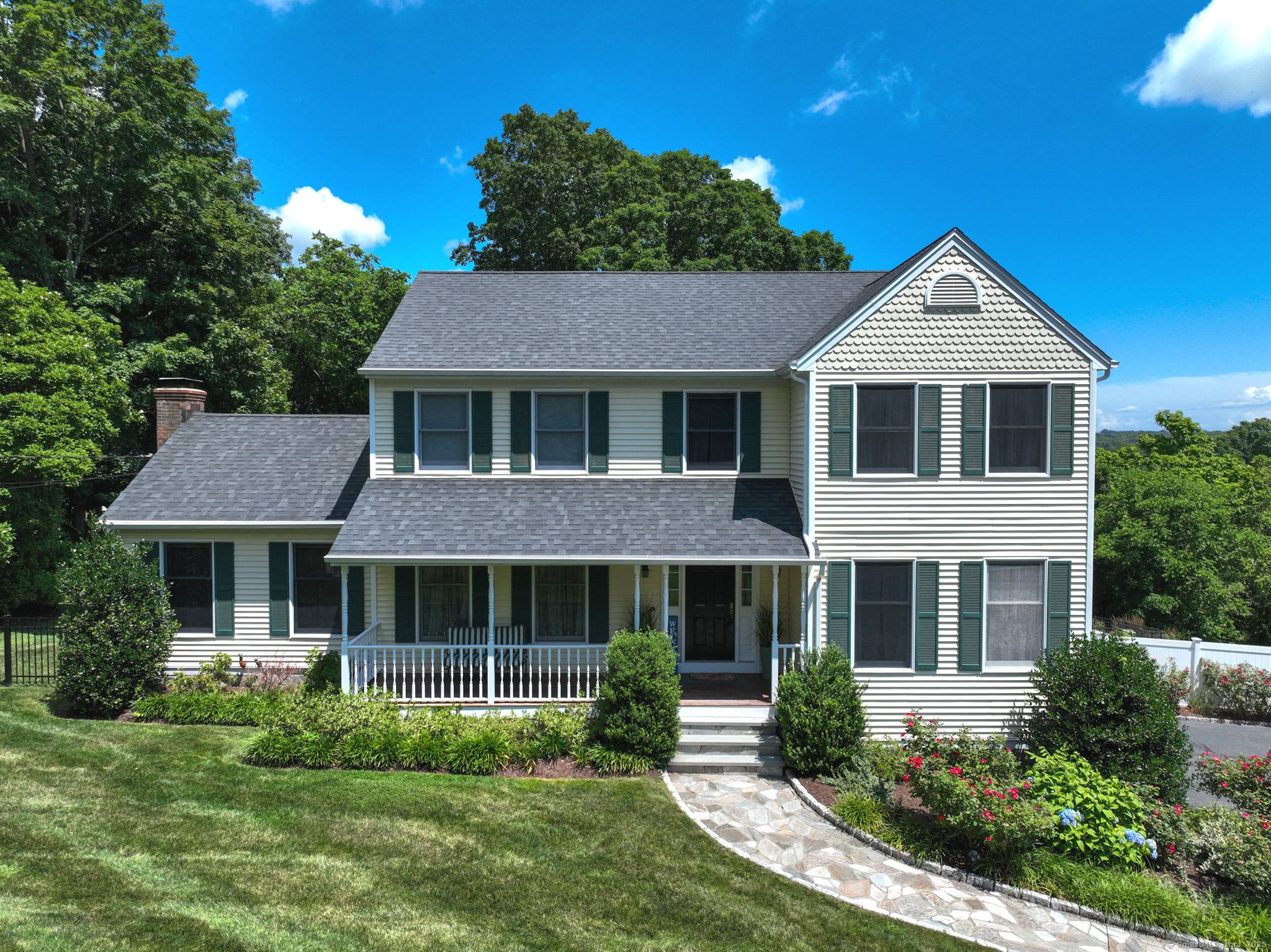 Nestled on a beautifully landscaped property within a well established neighborhood of distinguished homes, this colonial offers timeless charm and modern updates throughout.