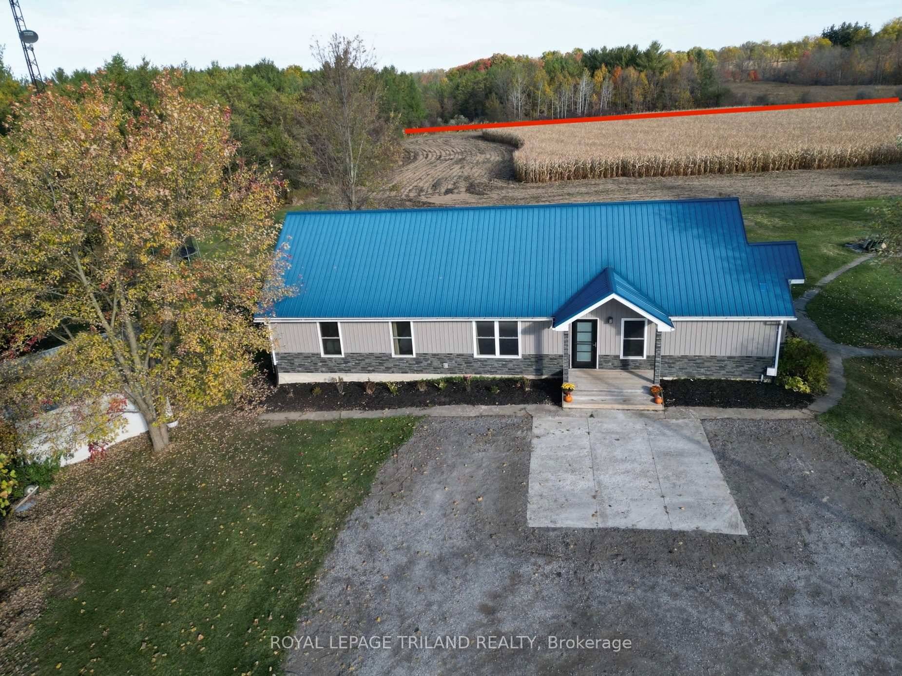 Come and View this 50 Acre Farm with Ranch Home, Forested Land, and Outbuildings.