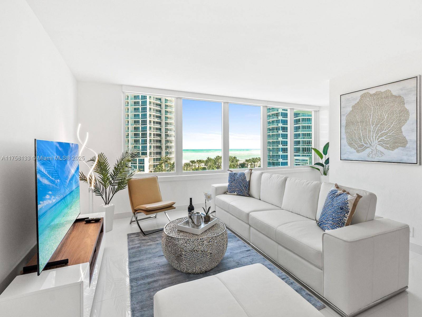 Completely remodeled 1 Bedroom Den 2 Baths residence with sweeping ocean vistas in the renowned South of Fifth neighborhood.