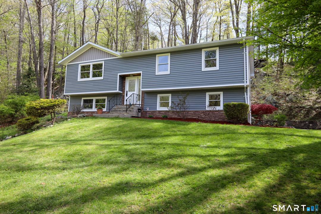 Welcome to 15 Wicks Manor in Danbury, a beautifully renovated raised ranch tucked into a quiet, peaceful neighborhood.