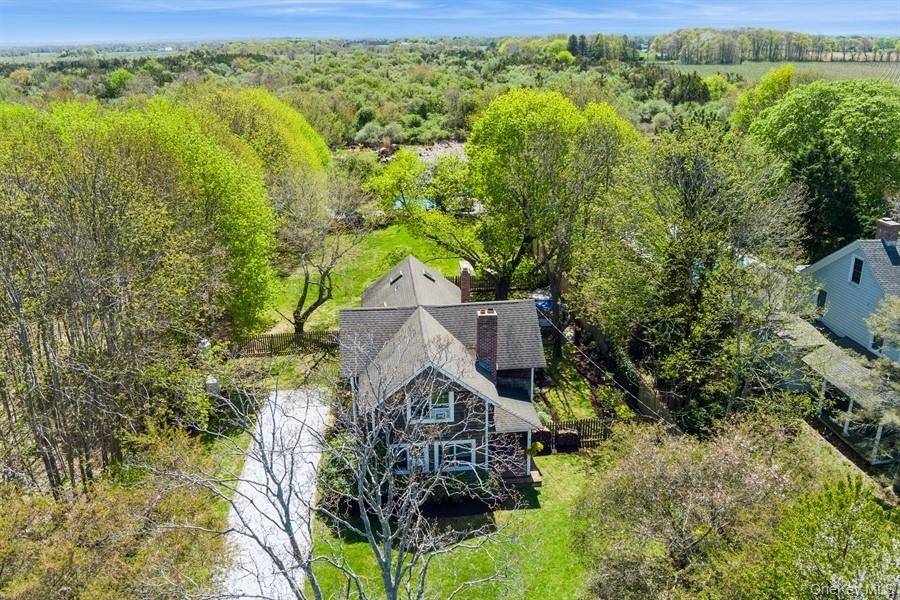 Explore this beautifully restored 4 bedroom, 2 bath farmhouse situated on highly desirable Oregon Road in the heart of North Fork wine country.