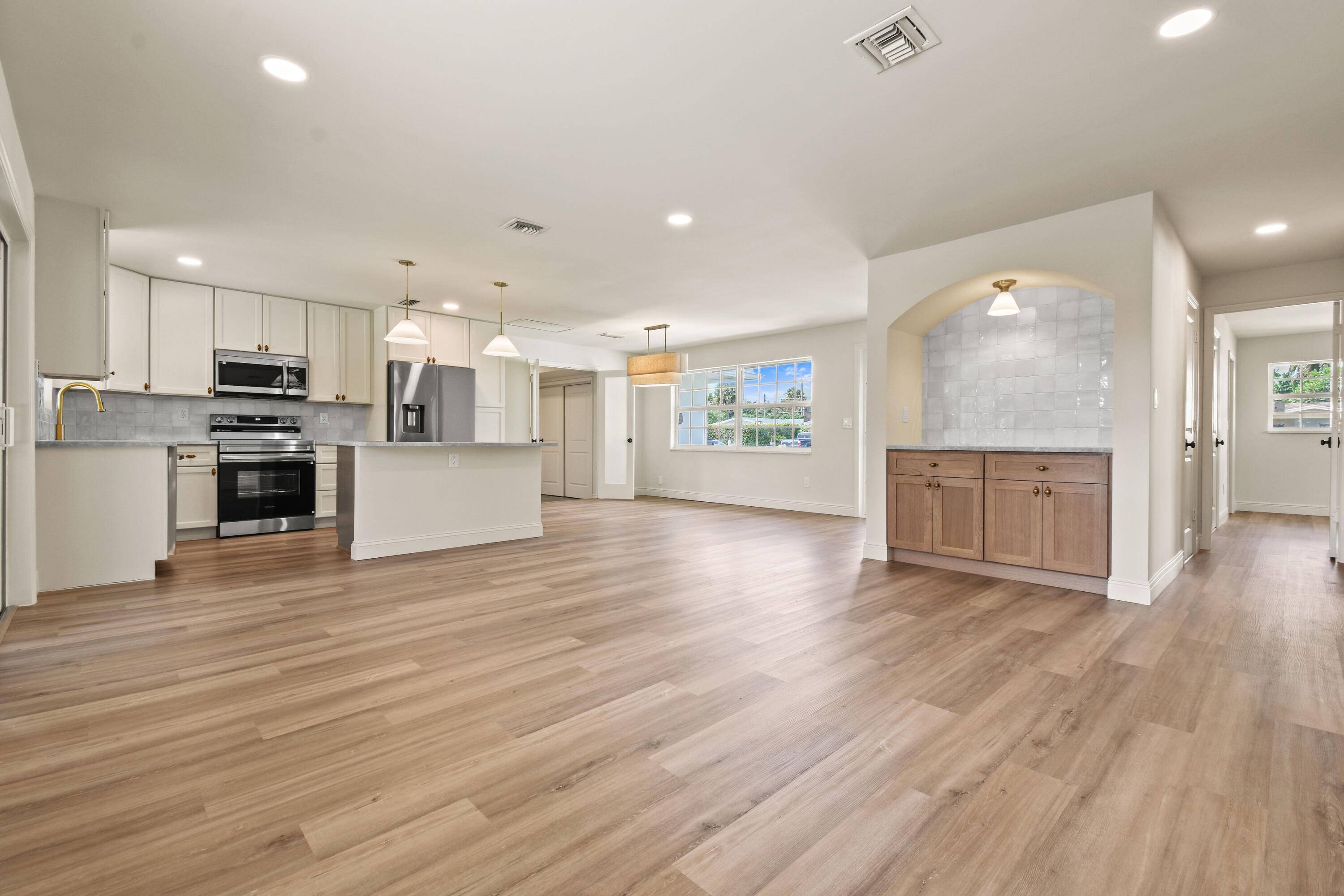 Thoughtfully designed and expertly curated fully remodeled 4 bedroom, 2 bath pool home in one of Palm Beach Gardens' most desirable NO HOA communities.