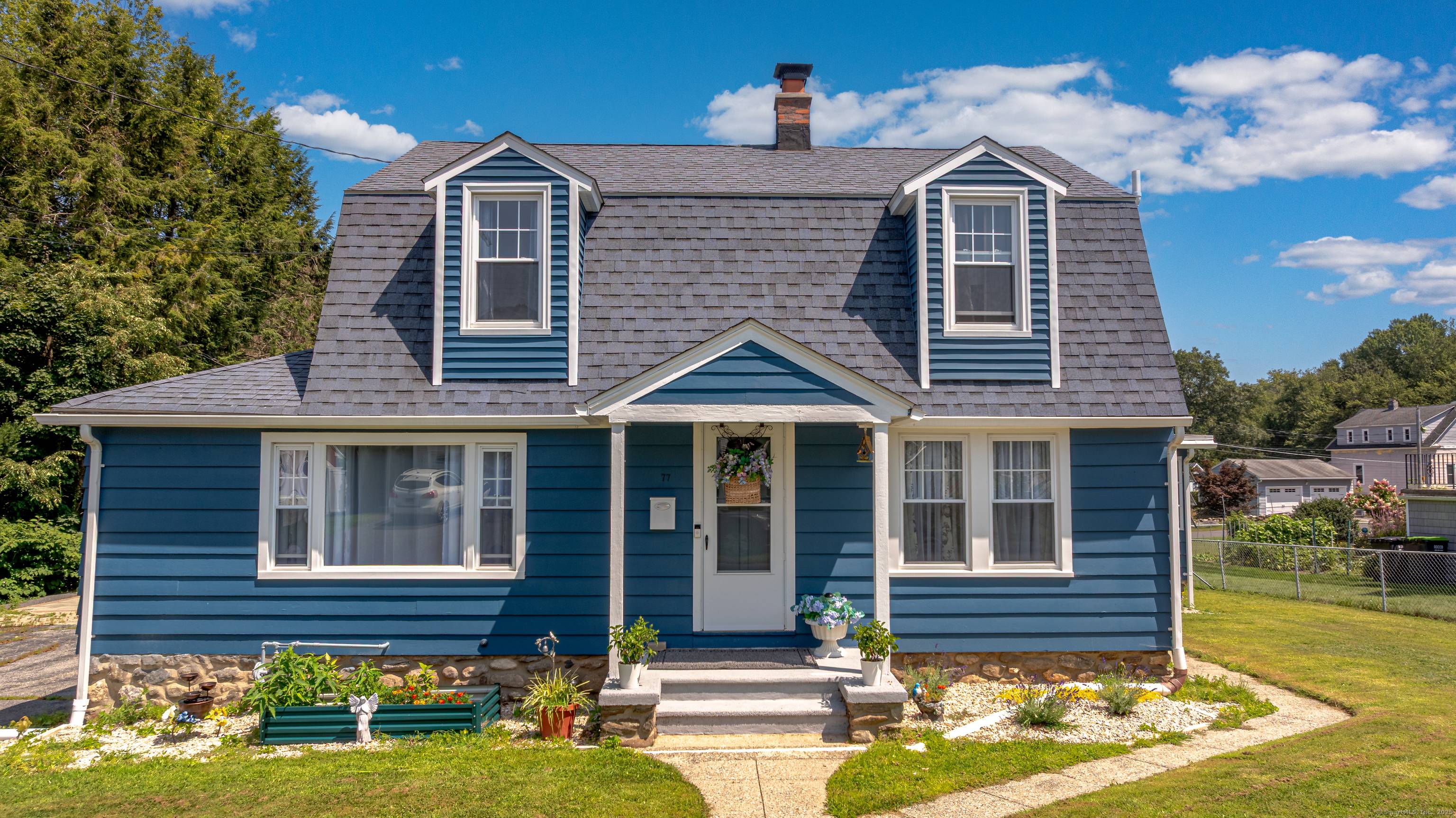 Charming remodeled 4 Bedroom Colonial with beautiful brand new kitchen with Quartz Countertops, soft close dovetail modern cabinetry, Center Island with Breakfast Bar and Stainless Steel Appliances.