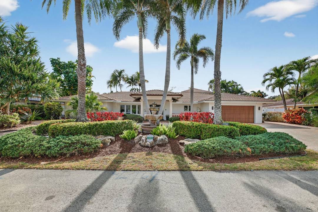 Meticulous one of a kind resort style estate on an oversized lot in Coral Ridge Country Club.