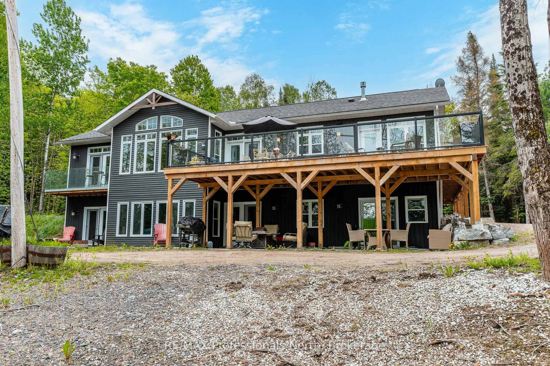 A must see custom built waterfront home on 3 lake chain This thoughtfully designed, finished and decorated, 4 Bedrooms 3 bathroom home has 2 stone propane F.