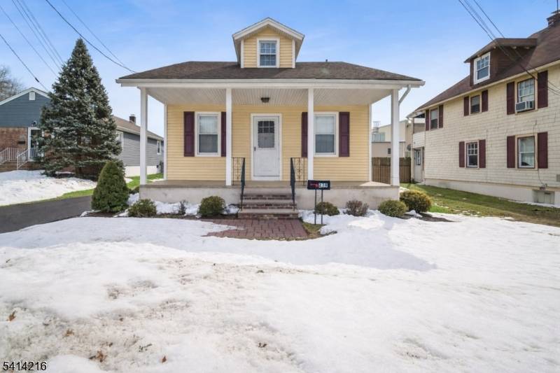 Charming two bedroom, one bath home nestled on a quiet street just moments from downtown Berkeley Heights and the train.