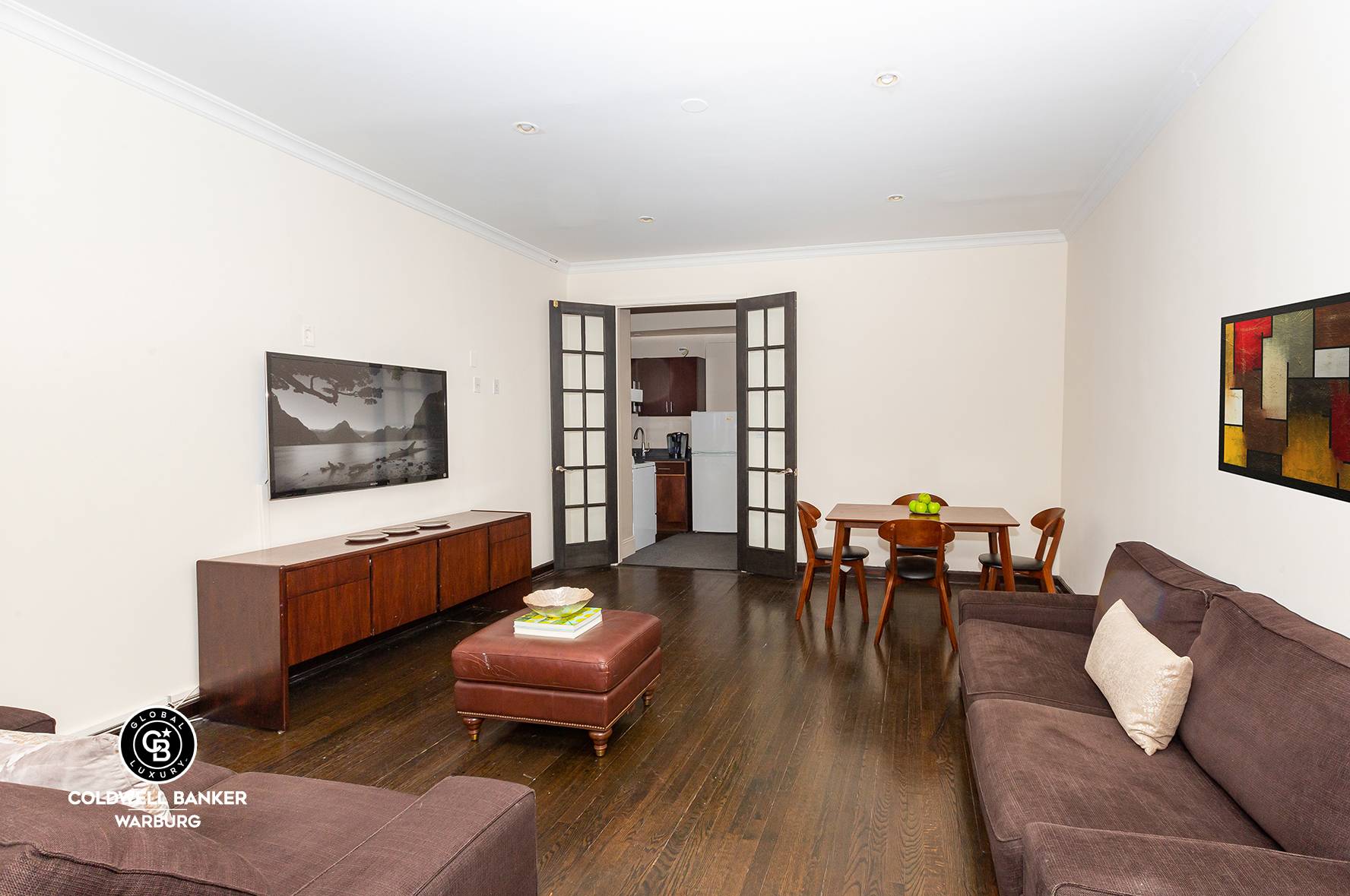 Expansive rooms with over nine foot ceilings, a private patio and an additional sunroom home office, make this spacious two bedroom, one bath Hell's Kitchen apartment unique in the neighborhood.