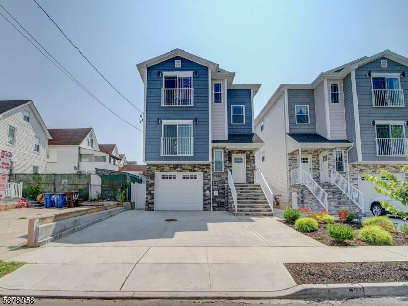 Built in 2023 and still eligible for a 5 year tax abatement, this stunning two family home is one of the finest in North Elizabeth.