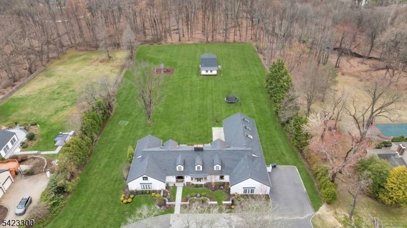 Welcome to 16 E Greenbrook Road situated on a pristine 2.