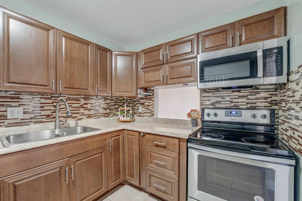 Introducing this beautifully maintained 2 bedroom 2 bath condo with stunning lake views in the desirable 55 community of Golden Lakes Village.