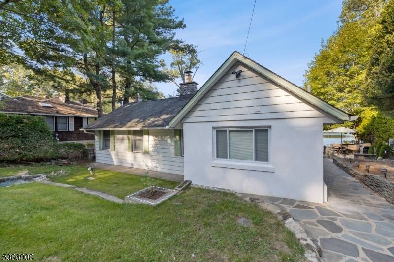 STUNNING VIEWS from this beautifully renovated 2 bedroom, 1 bath lakefront home in a vibrant, amenity rich community on desirable Erskine Lake.