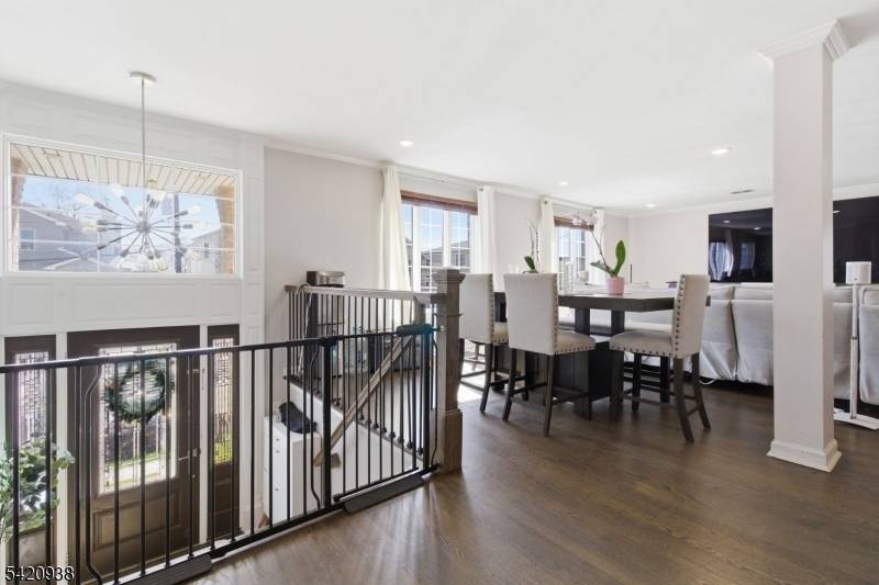 Beautiful custom built two family home built in 2017, both units feature open concept living and dining areas, hardwood floors, and modern kitchens with custom cabinetry, quartz countertops, stainless steel ...