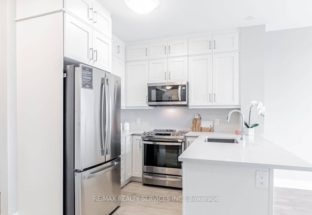Welcome to this beautifully upgraded 1 Bedroom Den suite in the sought after 5North Condos at 50 Kaitting Trail, located in the heart of North Oakville.
