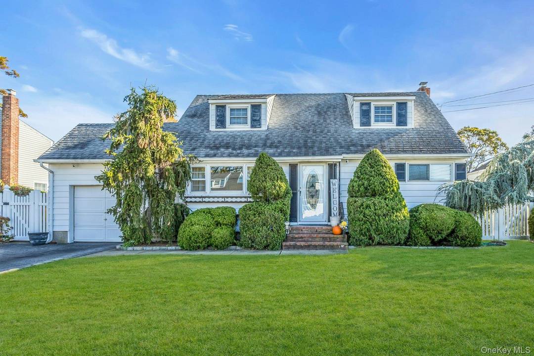 This Charming Cape Cod Home in Massapequa Park is Well Maintained and Boasts Four Spacious Bedrooms and Two Full Baths.