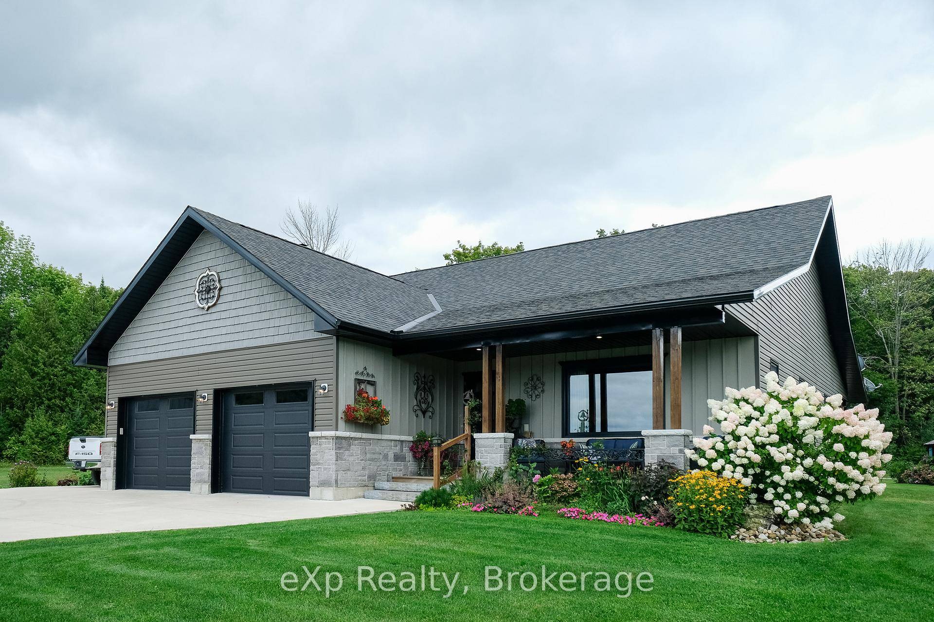 Set on 50 picturesque acres along Island View Drive Grey Rd 1, this property offers a rare blend of natural beauty and modern living.