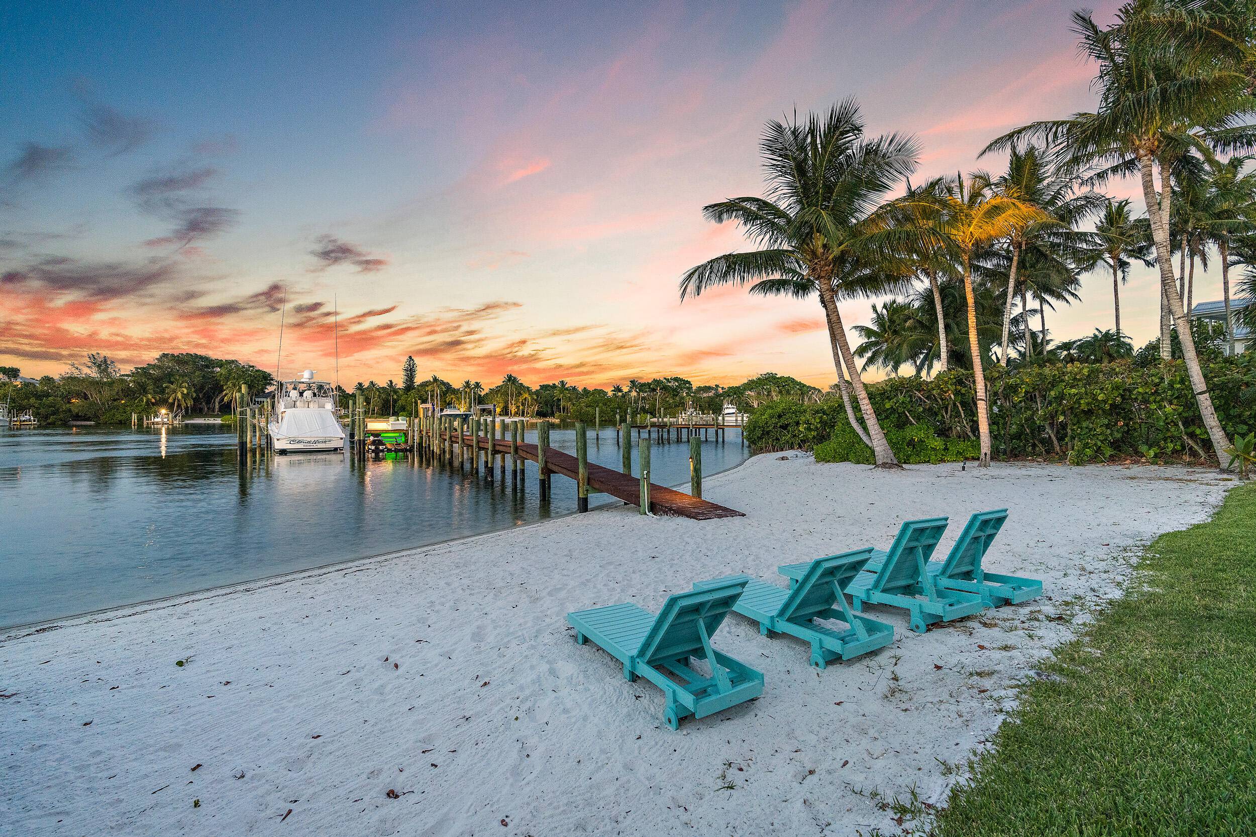 On 100 feet of blue, Intracoastal waters this plantation style estate on 3.