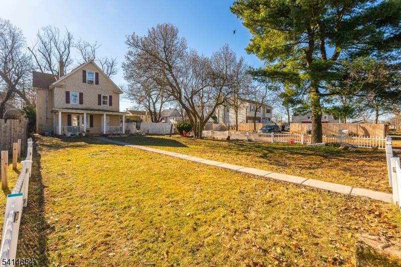 Welcome to this rare mother daughter style Colonial situated on a double lot in the highly desirable Netherwood Heights neighborhood.