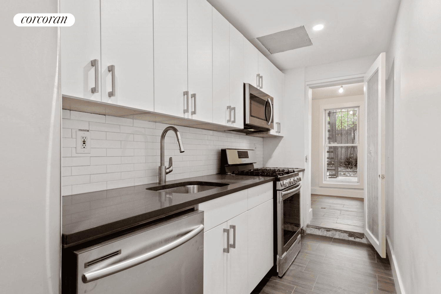 Updated ONE BEDROOM PLUS bonus space currently used as an office home with outdoor patio and shared garden access.