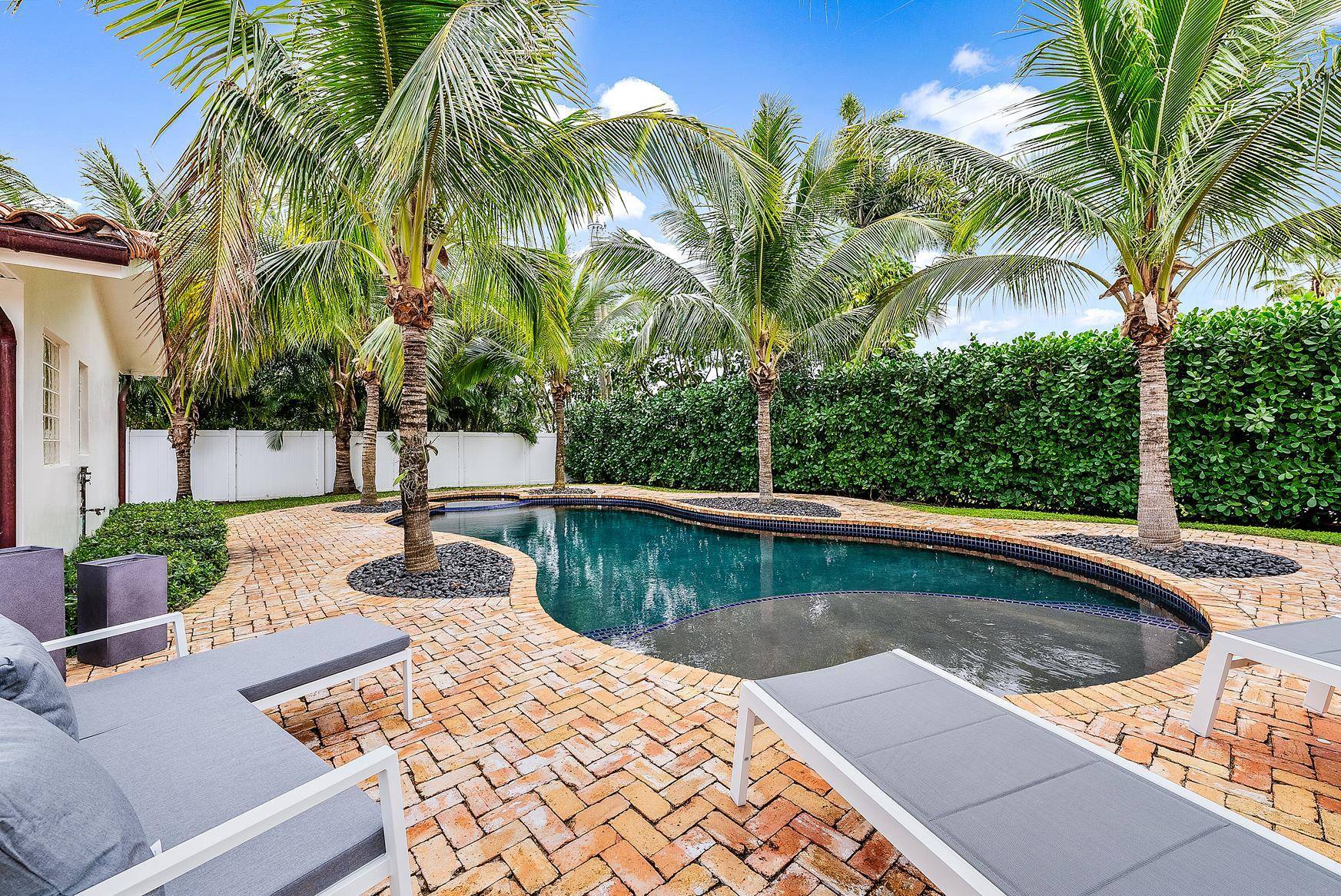 Beautiful 4 bedroom home with heated pool and spa in the popular Bermuda Terrace neighborhood in Tequesta.