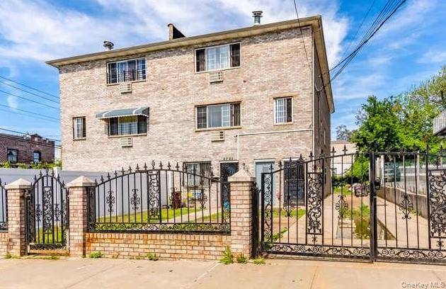 Welcome to this attached brick 3 family home located in the heart of the Williamsbridge section of the Bronx.