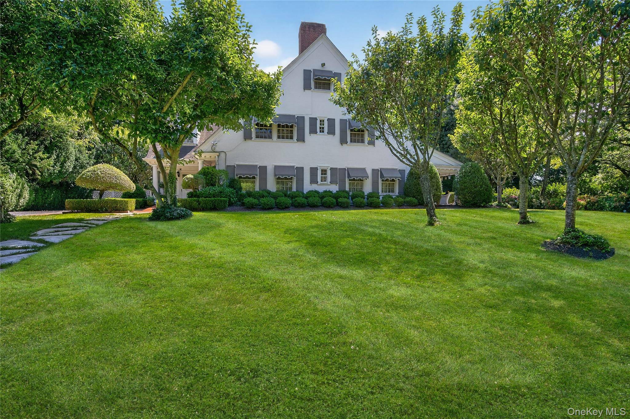 Discover timeless sophistication at 42 Clock Tower Lane, Old Westbury.