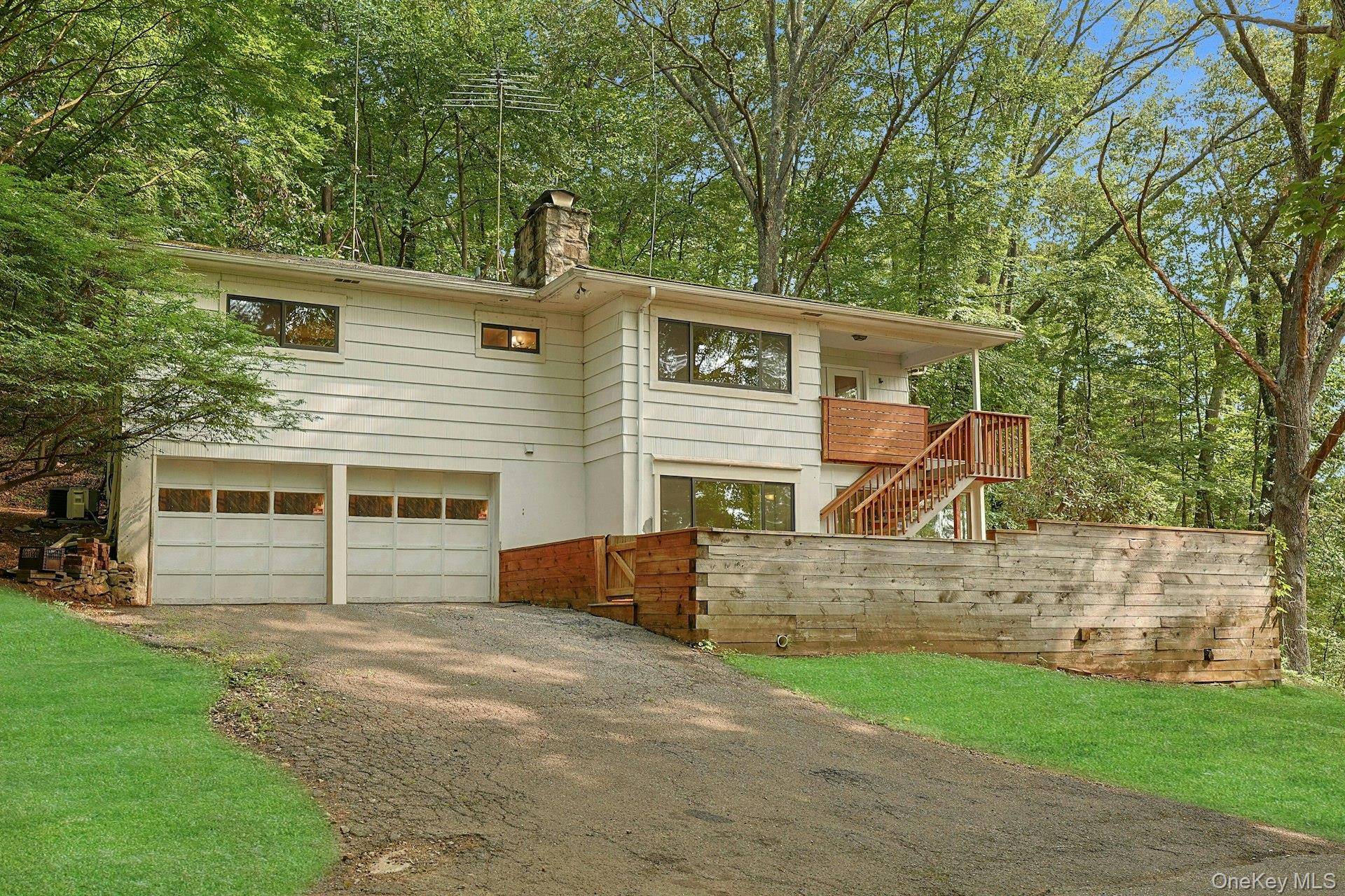 A private woodland oasis on the reservoir, just minutes to lovely downtown Croton Falls.