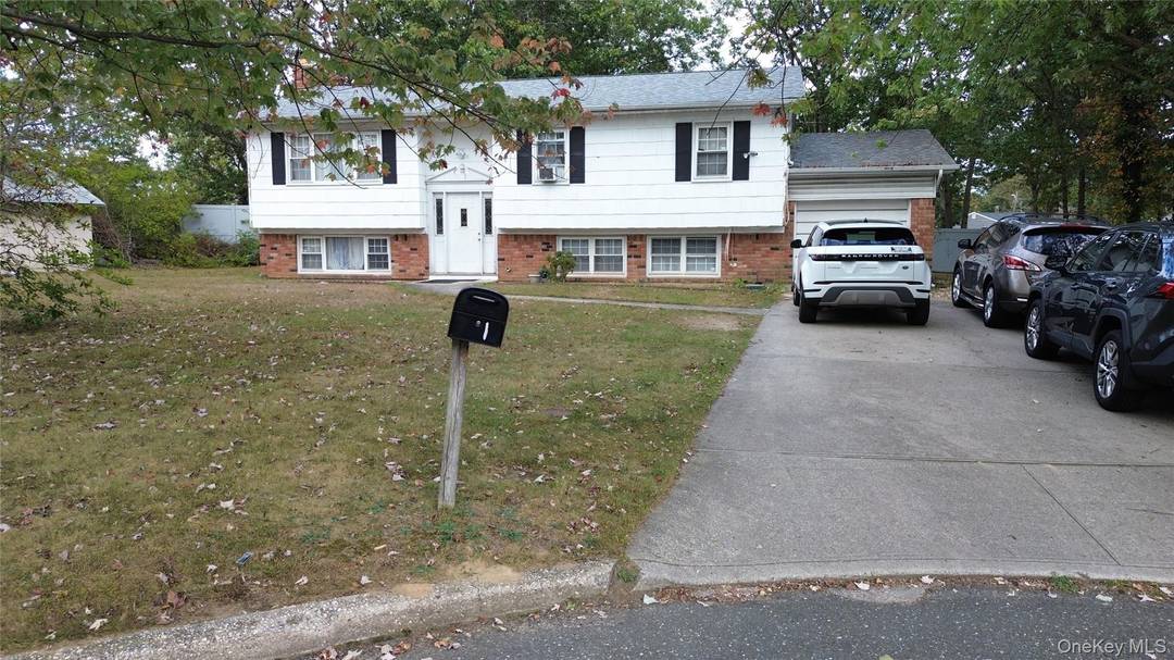 Investor Opportunity Awaits with this beautiful 5 bedroom 3 bath split level home in Holtsville.