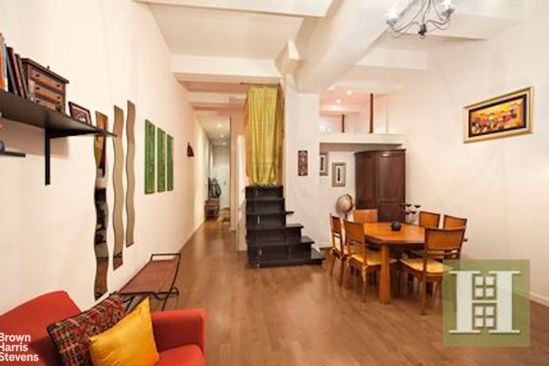 Beautiful loft style living with open living room dinning and 11 ft ceiling.