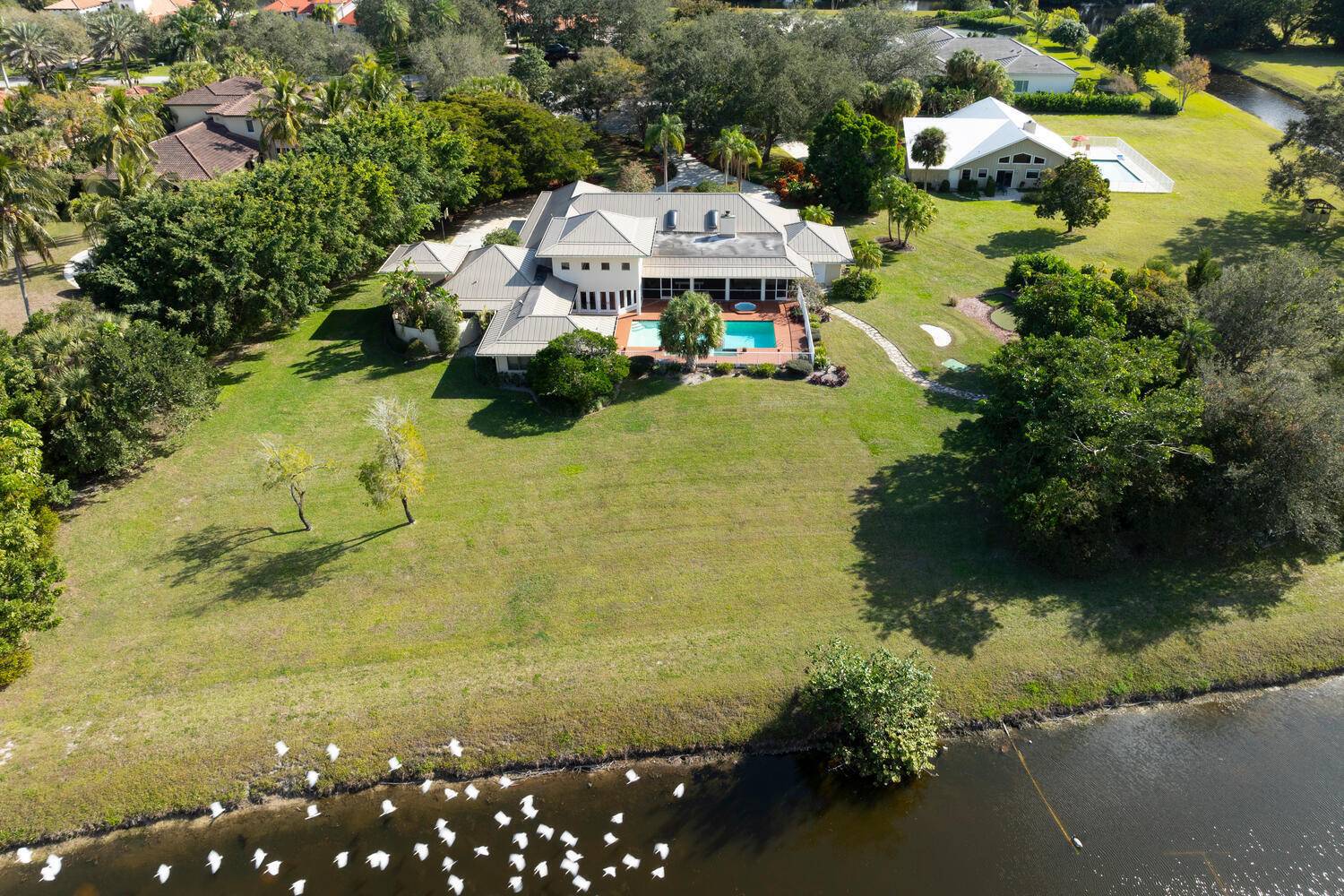 Welcome to your dream home, an entertainer's paradise featuring a new 2020 metal roof, set on a spacious 1.