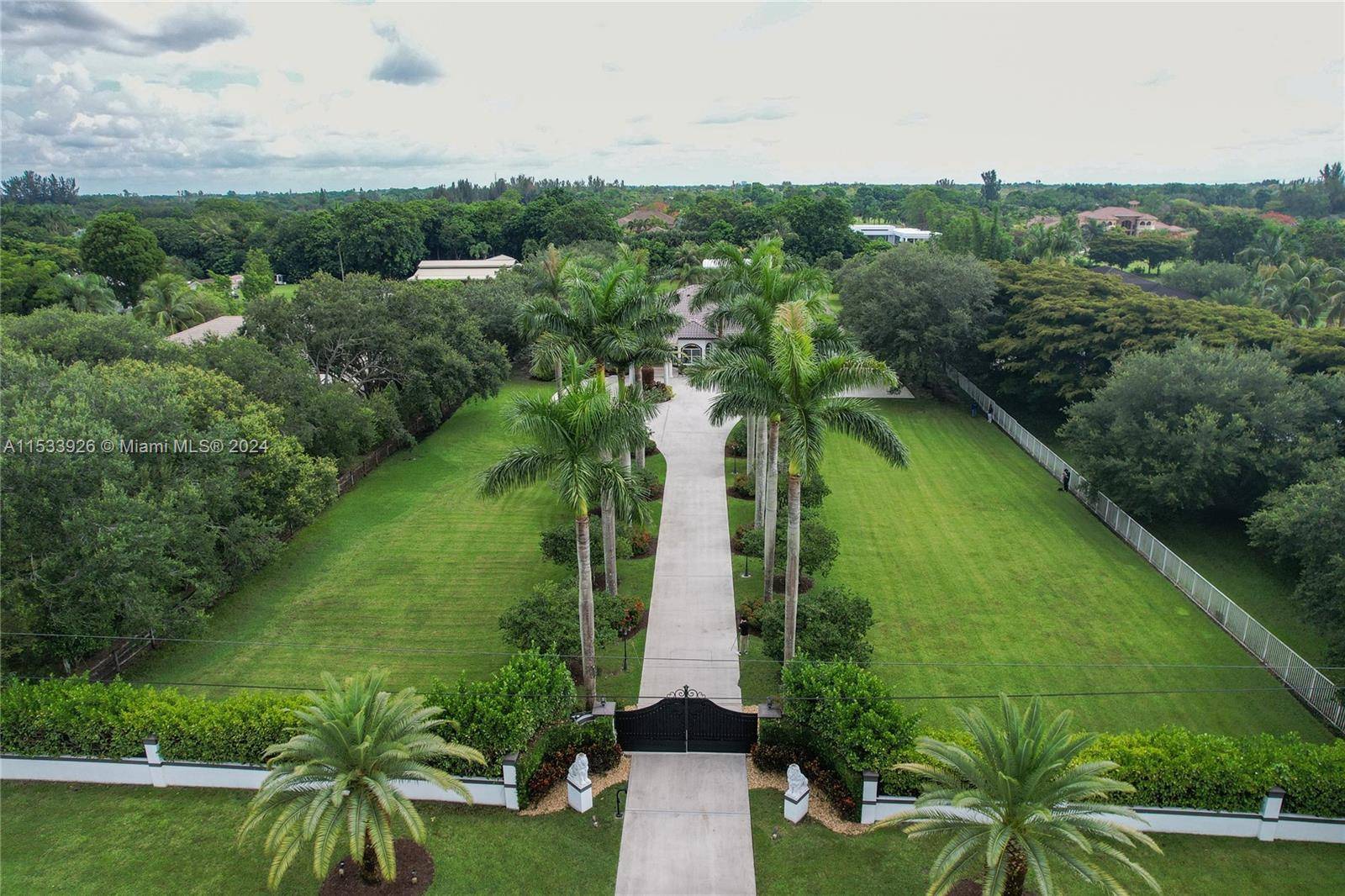 ENTER THROUGH THE PRIVATE GATES TREE LINED DRIVEWAY TO THE HOME OF YOUR DREAMS IN SOUGHT OF SOUTHWEST RANCHES.