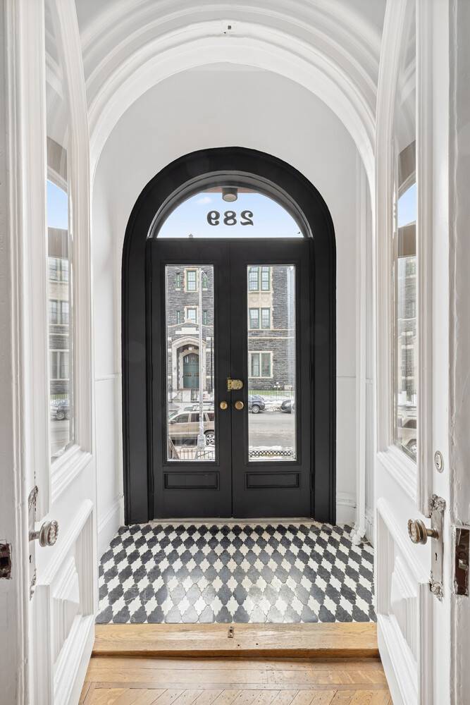 ELEGANTLY RENOVATED, PRE WAR GREEK REVIVAL CHARM.