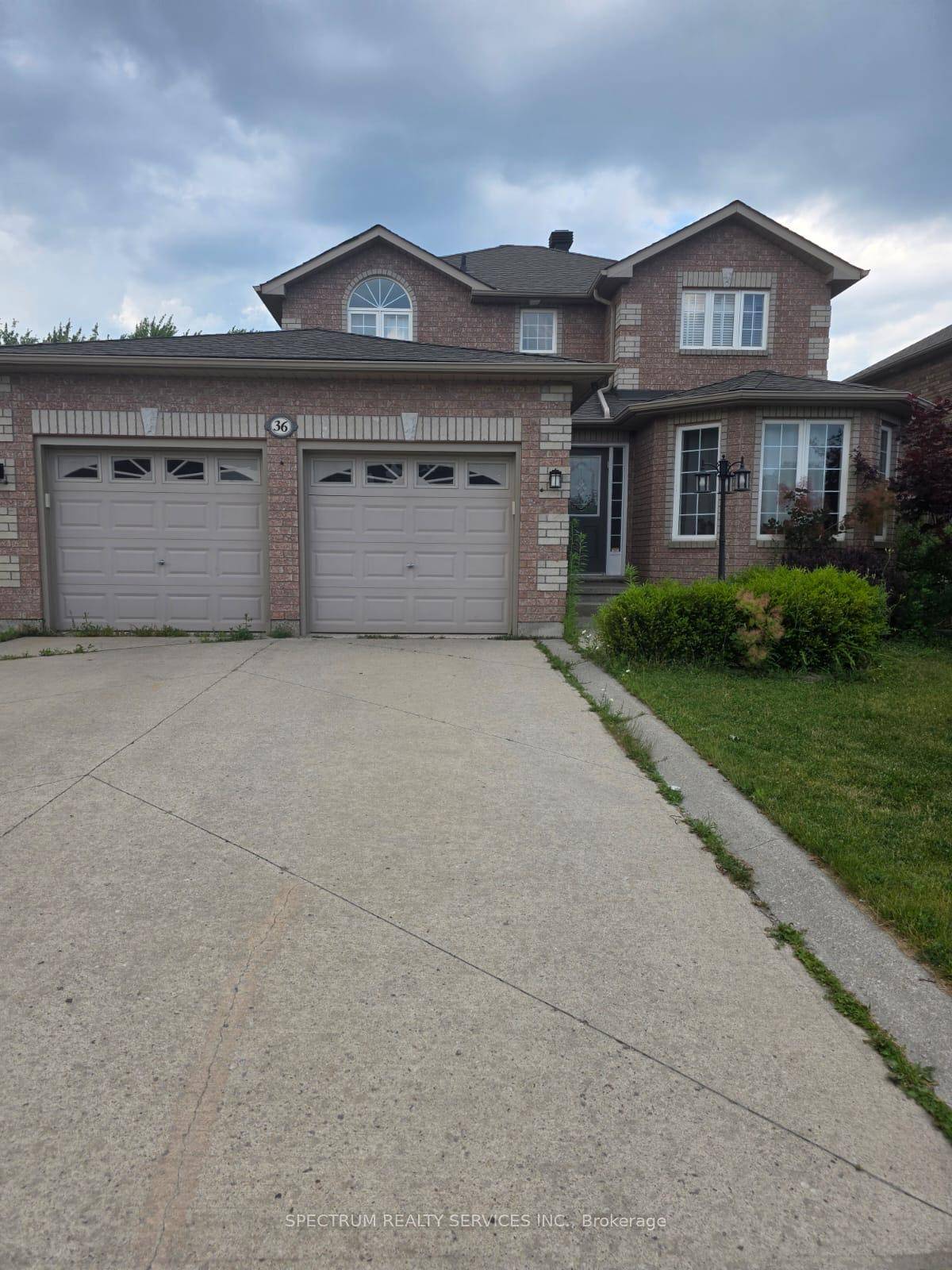 SAY YES to this beautiful All Brick Home Backing onto a Ravine in South Barrie's Prestigious Country Club Estates !