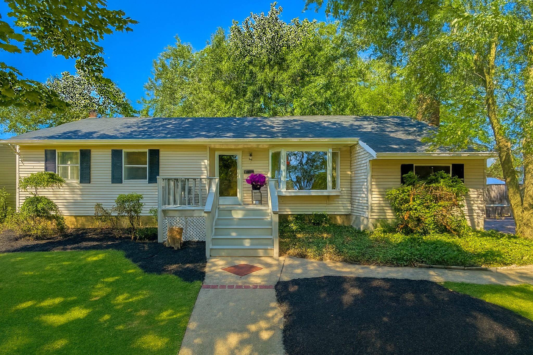 Welcome to 2 Unity Drive, a spacious and versatile 3 bedroom, 3 bath expanded ranch located in the heart of Centereach.