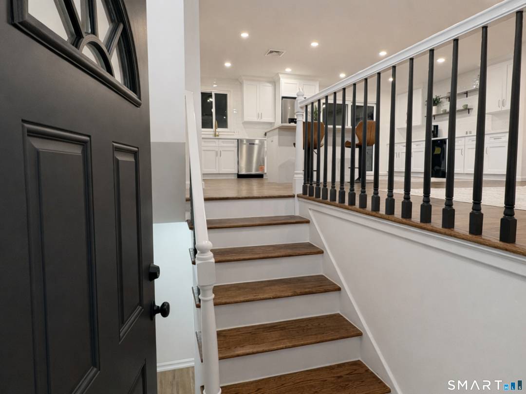 Welcome home to this beautifully upgraded raised ranch, tucked away on a quiet cul de sac in one of Wallingford's most desirable neighborhoods.