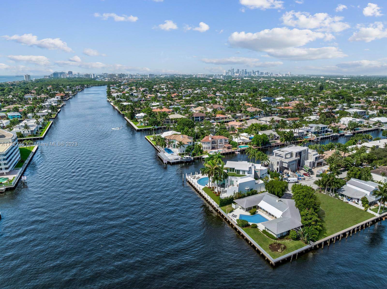 Amazing POINT LOT home in prestigious Coral Ridge neighborhood with over 185 feet of waterfront 125' on the intracoastal and 60' of side canal for private dock for your boat.