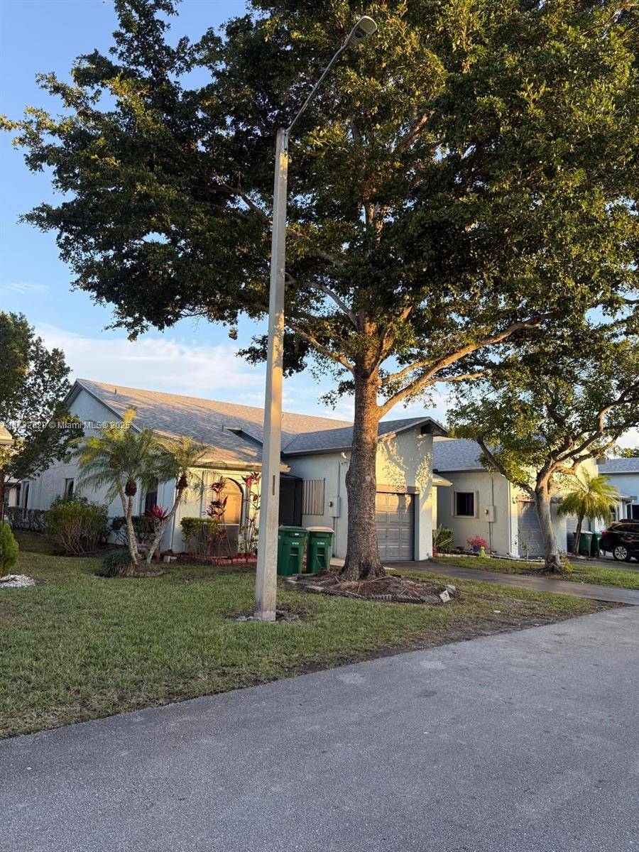 Welcome to this charming 2 bedroom, 2 bathroom townhouse with a den in the highly sought after community of Tamarac, Florida.