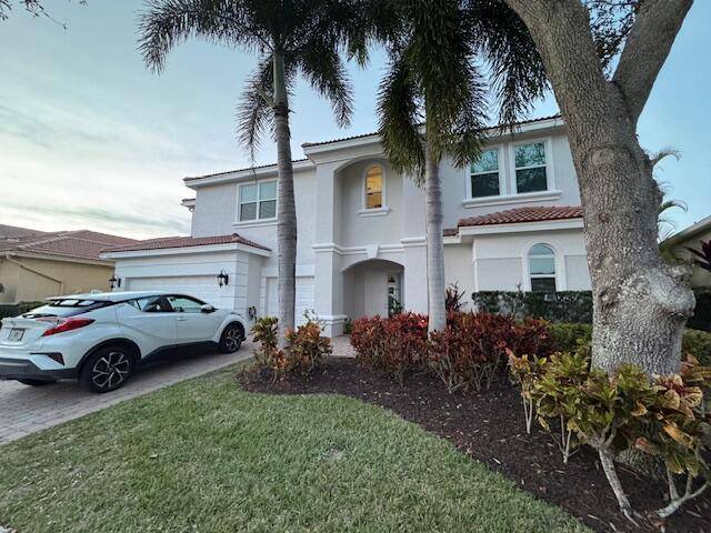 This courtyard home in a premier gated community offers spacious living areas with high ceilings and abundant natural light.