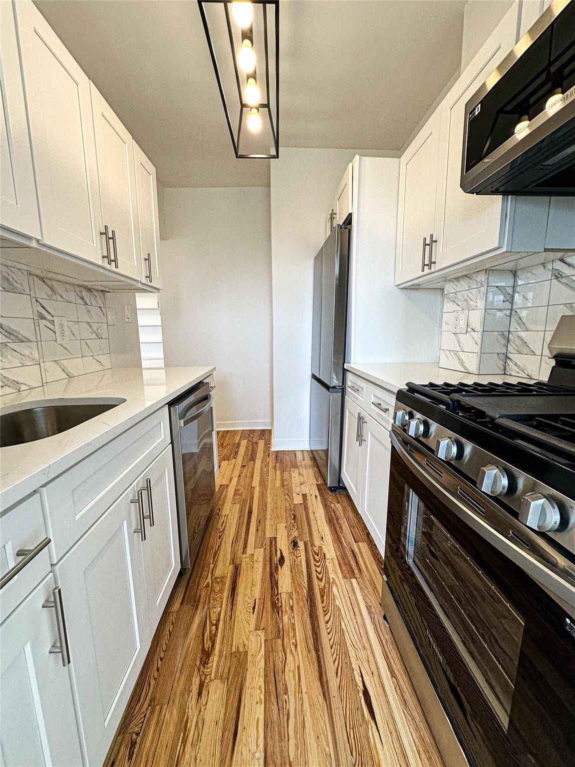 Gorgeous and completely renovated top floor Jr4 in prime Jackson Heights in the landmark district near the 74th St express subway station, restaurants, markets, shopping and a farmer's market.