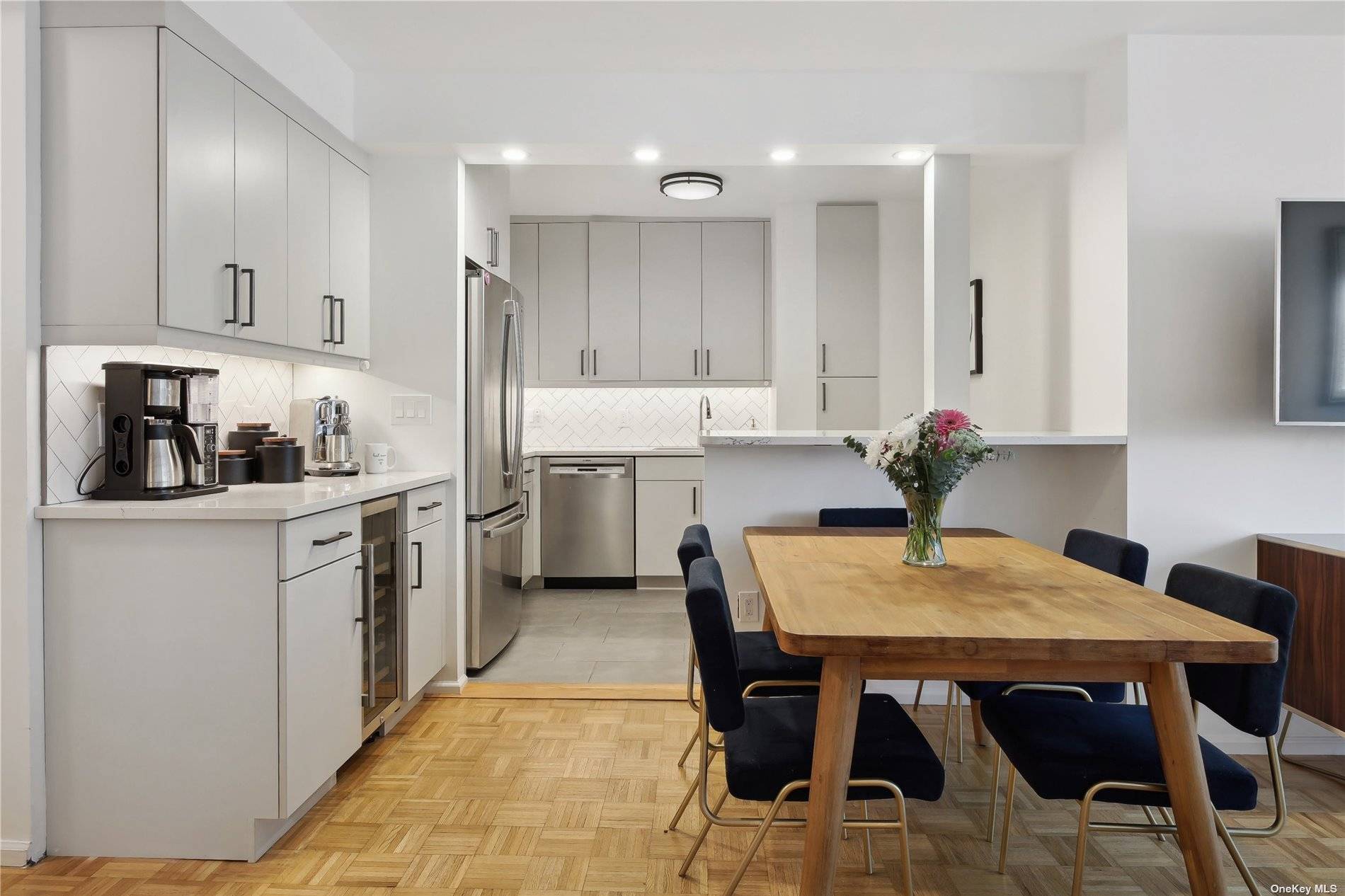 This home has an efficient layout boasting a roomy living dining room combo ; the open chef's kitchen boasts custom cabinets, complete with top quality Ceaserstone countertops.