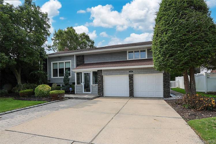 Located mid block in the Syosset School District, this immaculate, bright and spacious home offers 4 bedrooms, 3 full bathrooms, and a comfortable, functional layout perfect for everyday living.