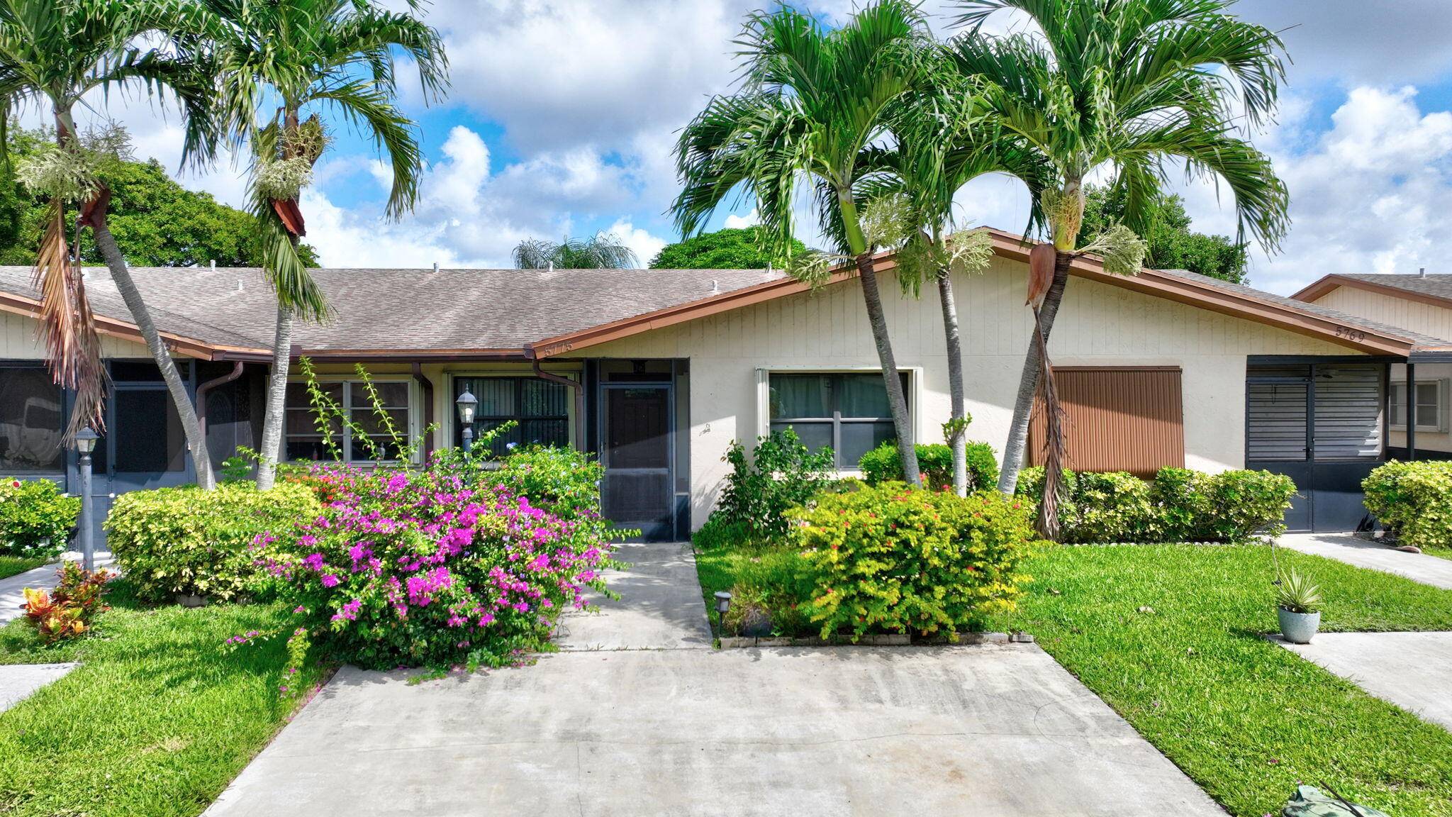 Enjoy your winters in Florida in this move in ready 2 Br 2 Bath with den and enclosed back porch overlooking a serene view of greenery !