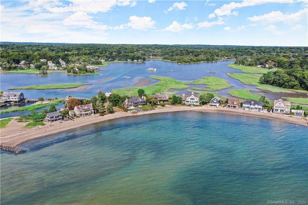 DIRECT WATERFRONT WITH 100' of PRIVATE BEACHFRONT AND RARE OPPORTUNITY TO BUILD A STUNNING HOME ON COMPO MILL COVE WITH A POOL.