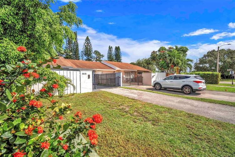 Welcome to this stunning turn key home in Greenacres, fully renovated with modern finishes and thoughtful design.