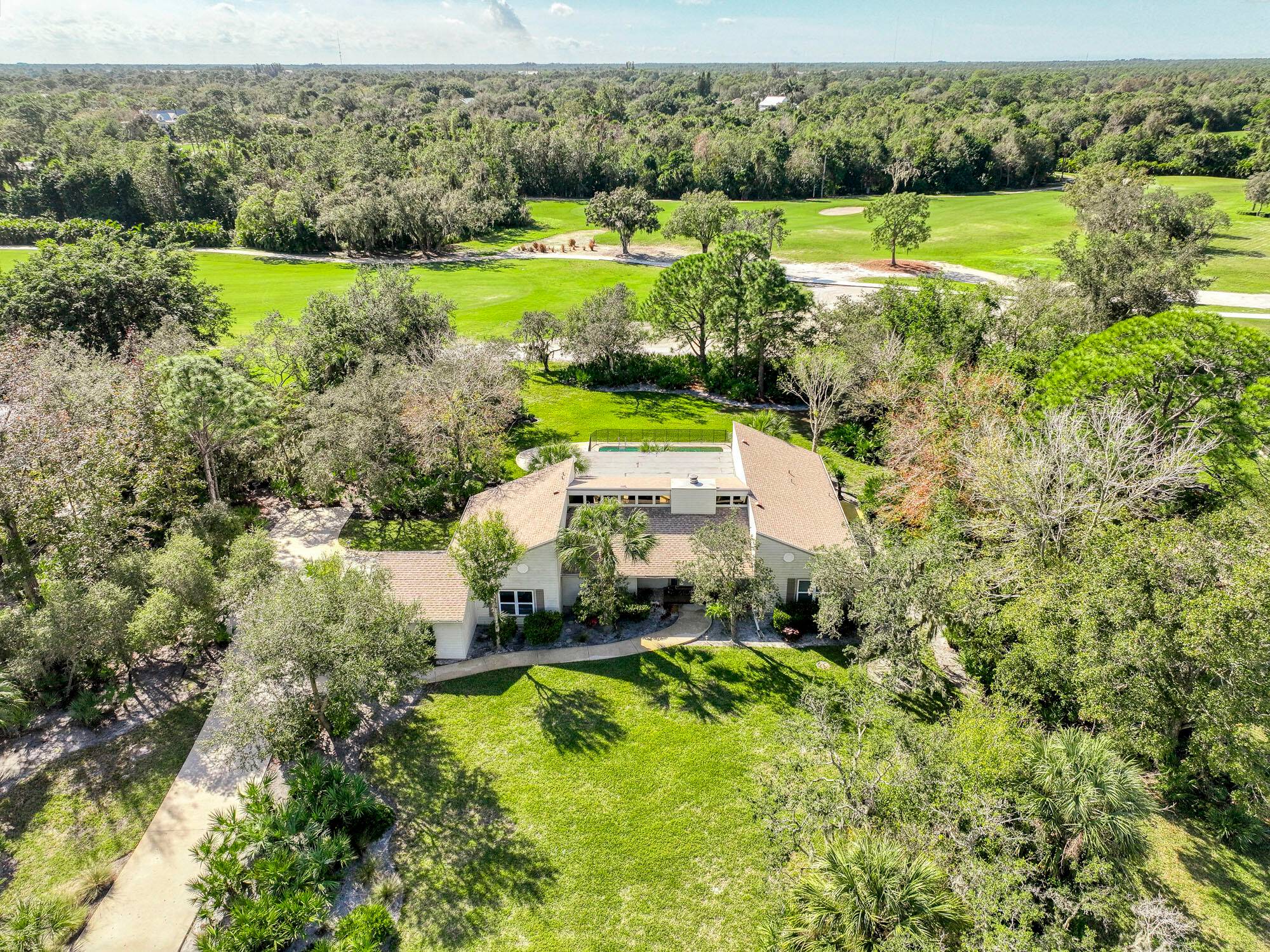 Welcome to this luxurious Crane Creek residence located within the gated Martin Downs Country Club community.